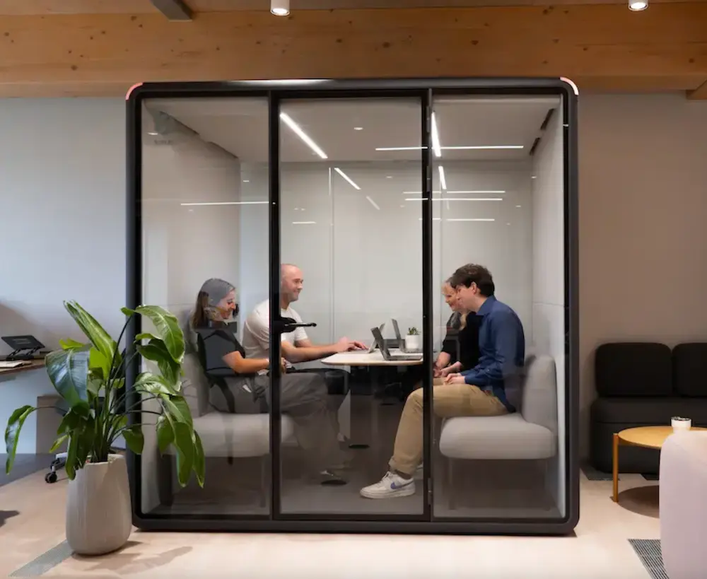 Bureau booth interior in a London office, lights on